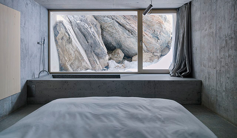 Illustration for article titled This Cozy Log Cabin in the Swiss Alps Is Completely Made of Concrete